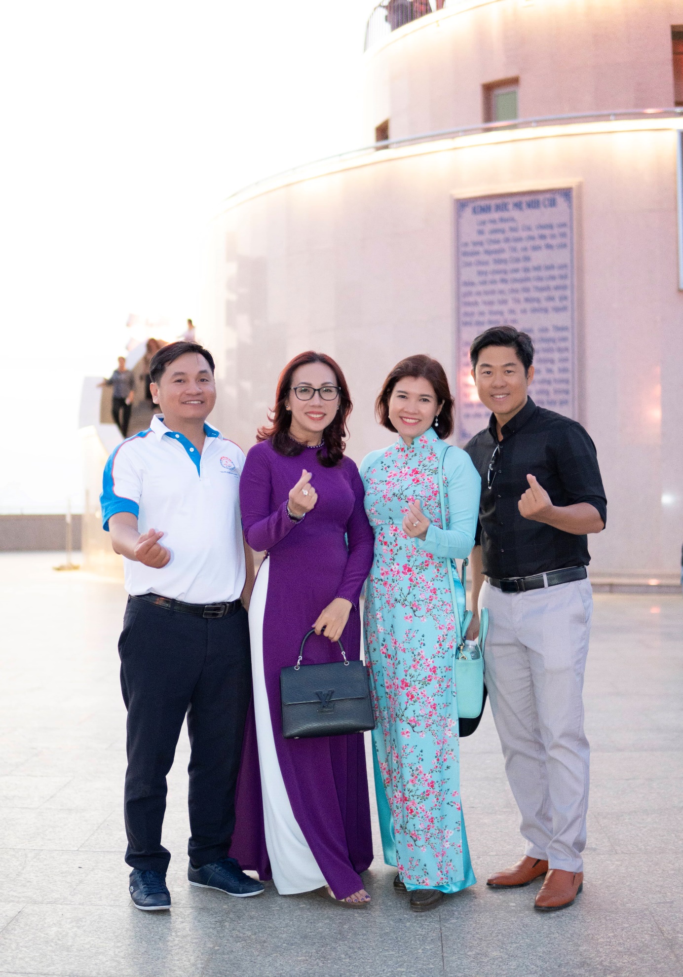 A group of people posing for a photo Description automatically generated