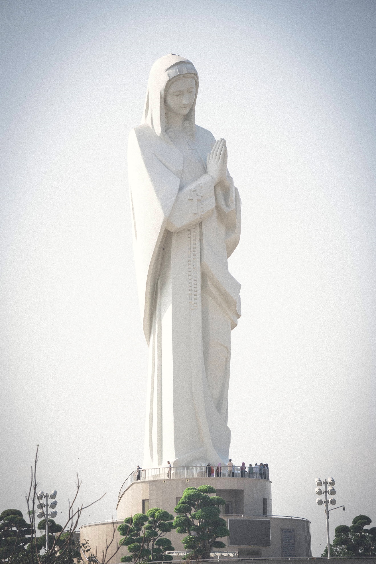 A large white statue of a person Description automatically generated