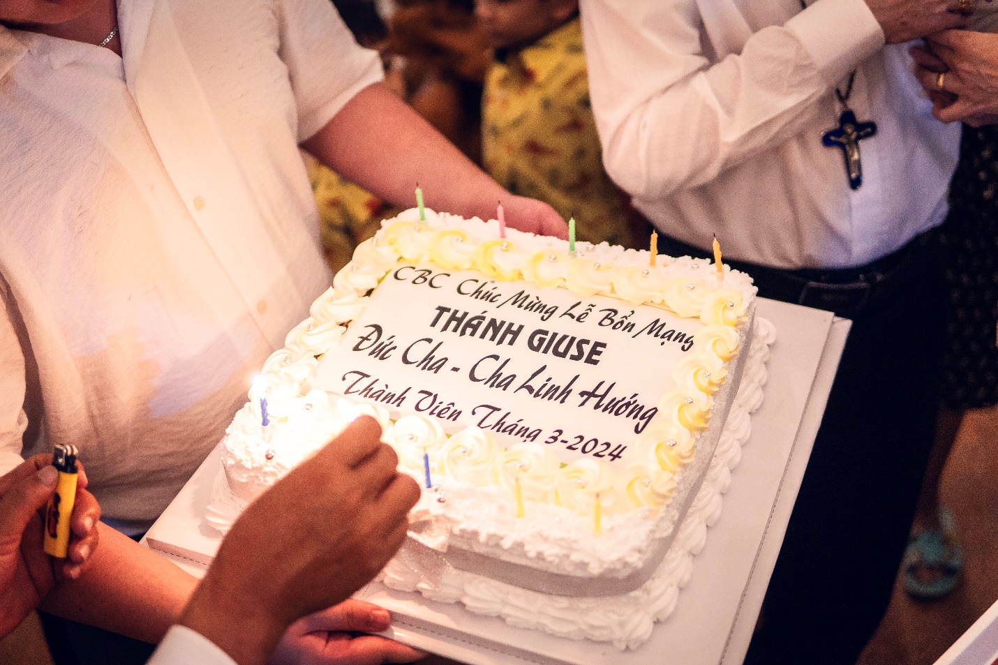 A person cutting a cake Description automatically generated