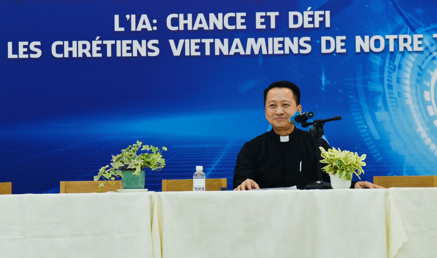 A person sitting at a table with a microphone Description automatically generated
